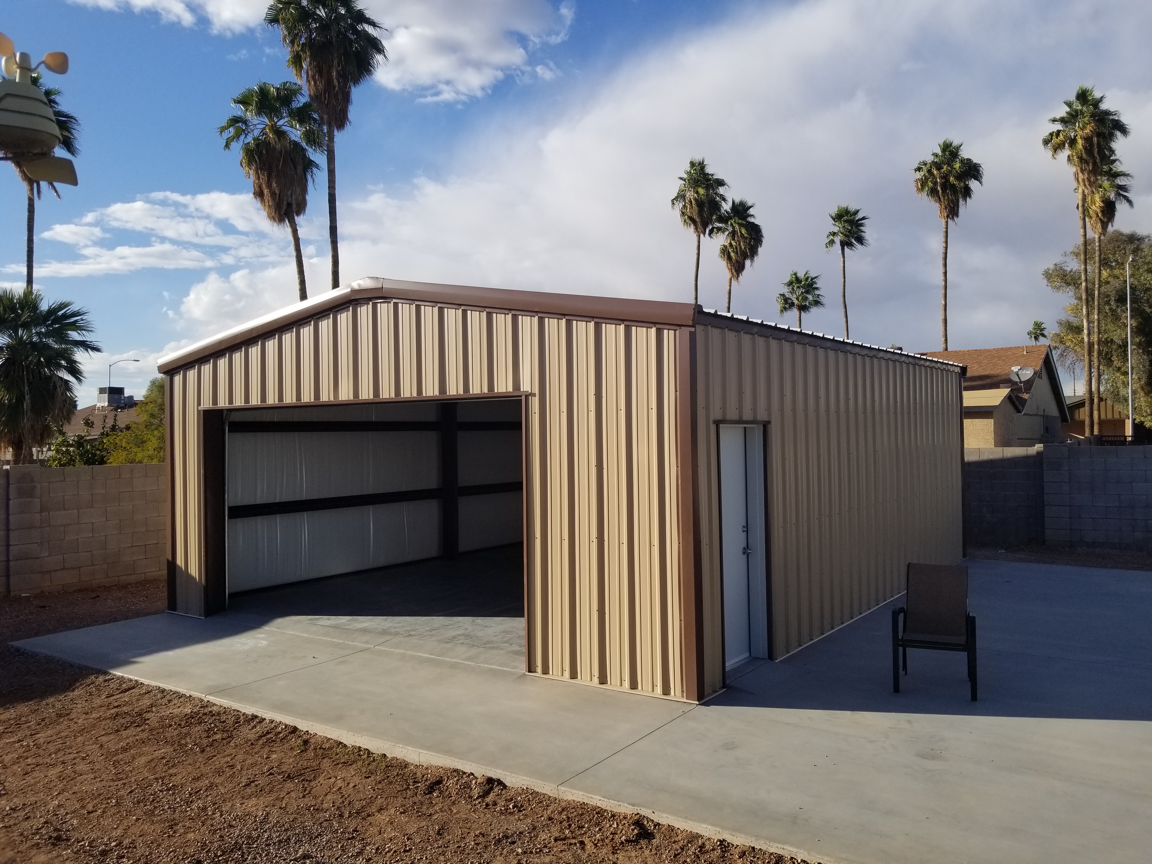 Showing a small steel building with a large concrete apron. Emphasizing our capacity to do concrete features in addition to the building foundation