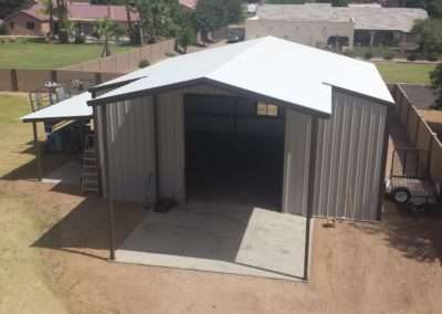 Showing a steel building with multiple shade covers. Emphasizing our capacity to build custom shade covers that meet our customers needs.